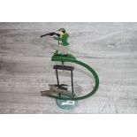 Vintage Novelty Metal Enamelled Rocking Display featuring a Man with a Gun chasing a Stag, 41cms