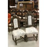 Two Similar Victorian Oak Hall Chairs, each profusely carved and with barley-twist supports, one