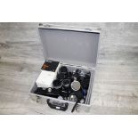 Camera case with a collection of vintage Pentax fit items to include two Pentax ME Super SLR