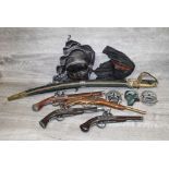 Two Indian Swords, four replica Pistols & a small collection of Masks