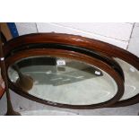 Two Wooden framed oval wall Mirrors with bevelled glass