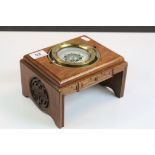 Ships Compass set on an Oriental Carved Wooden Stand