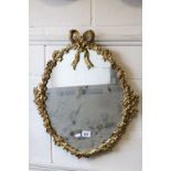 Ornate Oval gilt metal wall mirror with Bow, Floral and Foliage Cast Frame, 58cms high