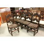 Set of Six Continental Oak Dining Chairs, the arched back rail and splats carved with green man