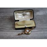 Edwardian enamelled 9ct gold half hunter wristwatch, the white enamel dial with black Arabic