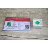 Loose octagon cut emerald, accompanying certificate stating weight 7.37 carats, dimensions 11.56 x
