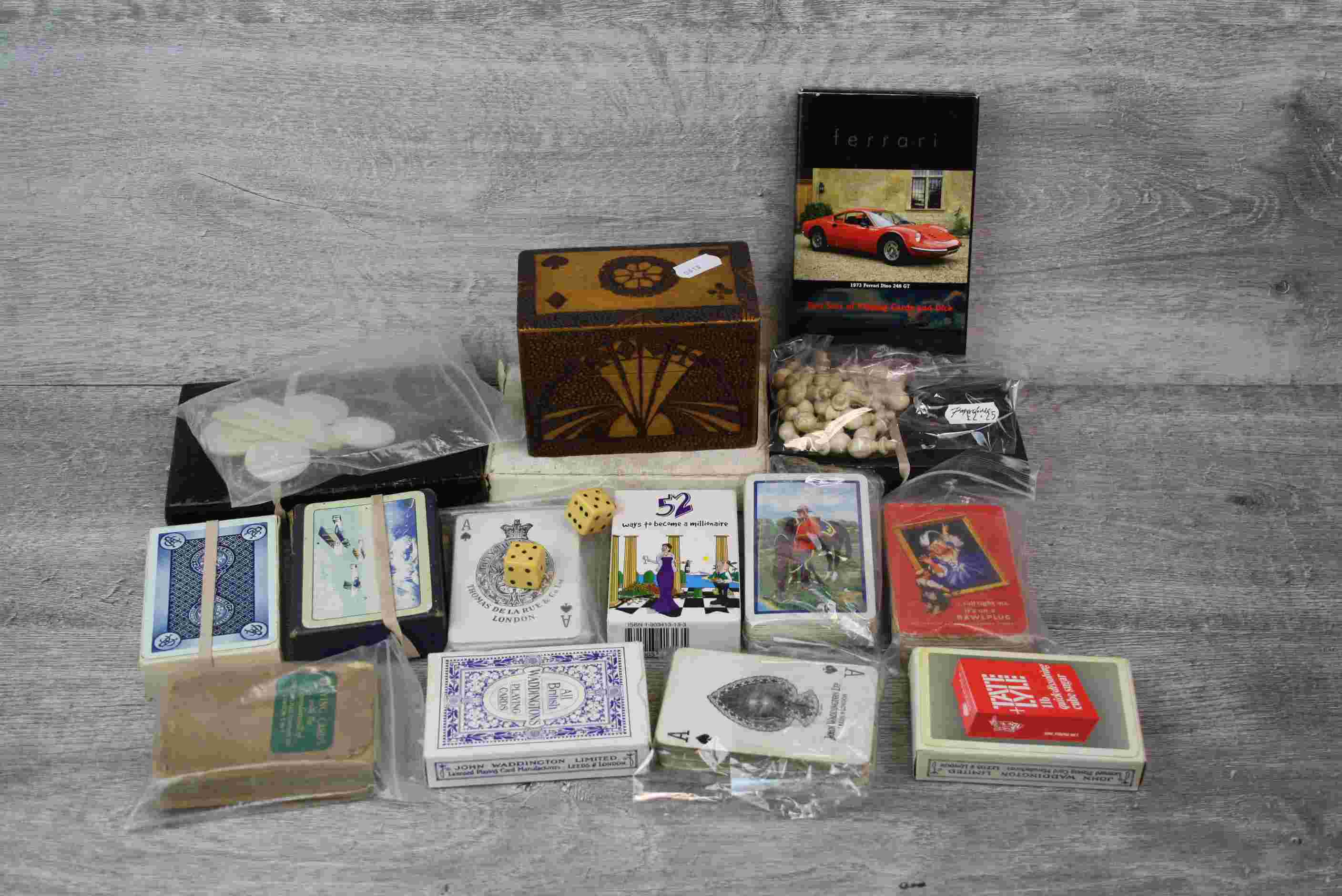 Collection of advertising playing cards, games pieces, mother-of-pearl gaming counters and a