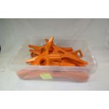 Collection of 1970's orange plastic Leifheit Primus 50 coat hangers