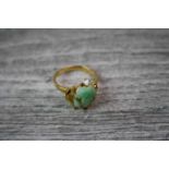 Diamond and jade type gold plated ring, the jade type carved frog within yellow gold frame, small