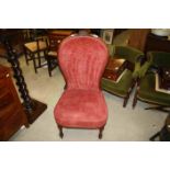 19th century Walnut Framed and Red Upholstered Balloon Back Nursing Chair raised on Turned Front