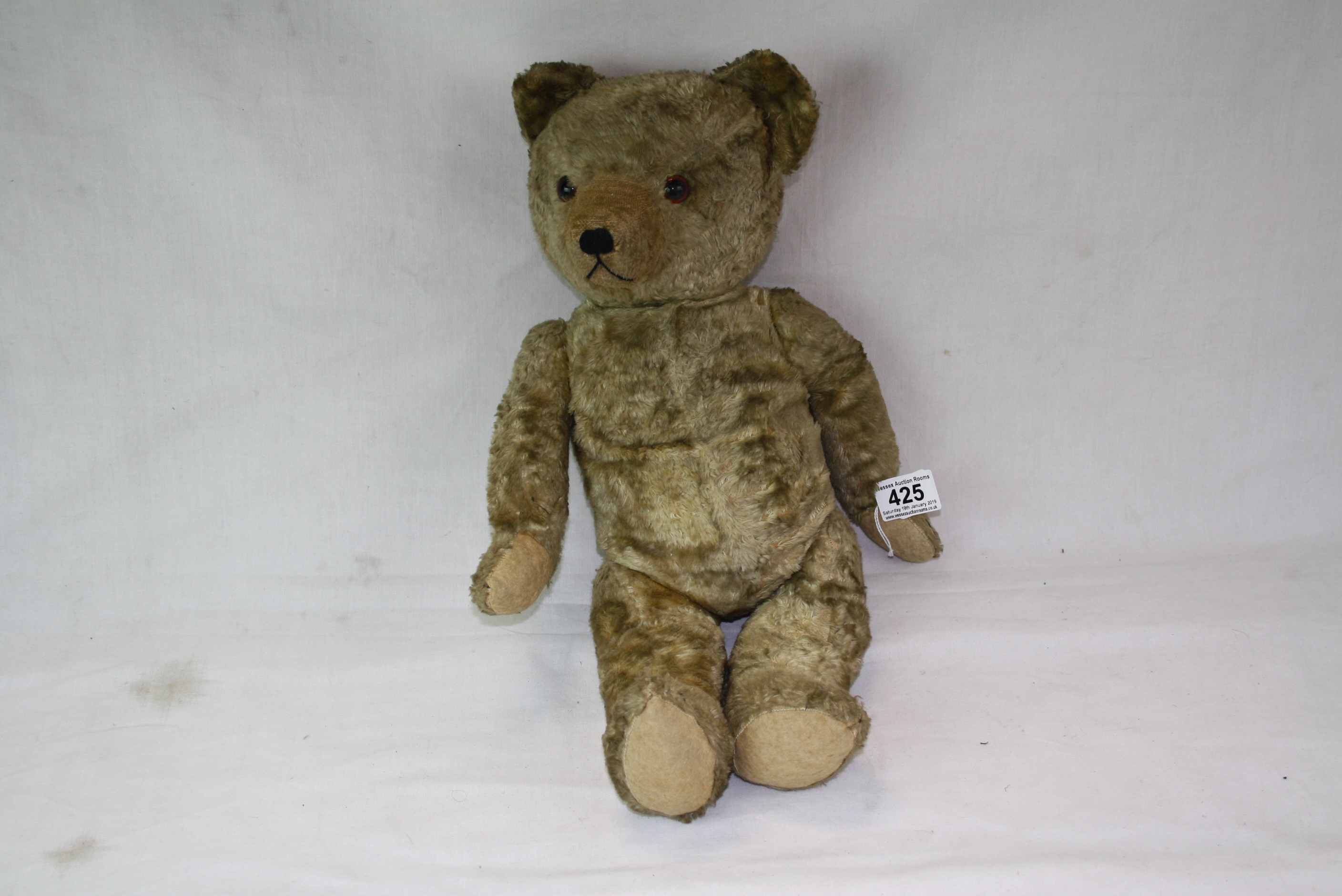 Vintage straw filled Teddy Bear with adjustable limbs