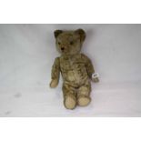 Vintage straw filled Teddy Bear with adjustable limbs