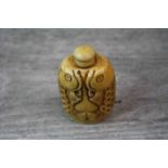 Oriental bone snuff bottle in the form of two fish