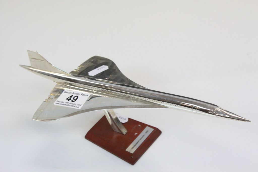 Chromed model of Concorde with wooden stand and plaque