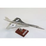 Chromed model of Concorde with wooden stand and plaque