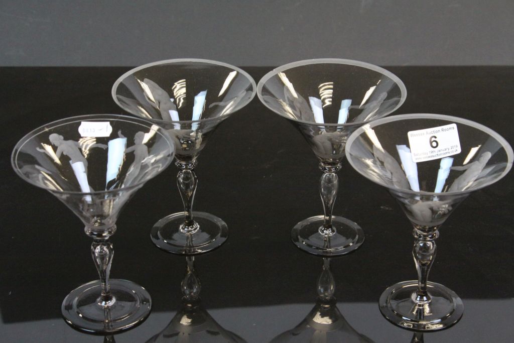 Four Champagne glasses, Scandanavian style with engraved Dancing Nude female figures