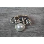 Silver Brooch in the form of a Cat Playing with a Large Pearl Ball