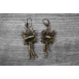 Pair of white metal Modernist drop earrings, circa 1970, interlocking twig and panel textured