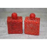 Two oriental snuff bottles, red lacquer style, dragon and bamboo decoration, height approximately