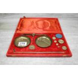 Cased set of Indian portable hanging weighing scales with weights