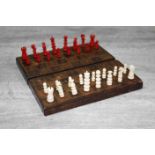 19th century travel chess board, bone chess pieces, leather covered board