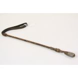 Riding crop with brass handle and plaited wound stem