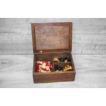 Wooden games box containing bone chess set, wooden chess set and a wooden draughts set