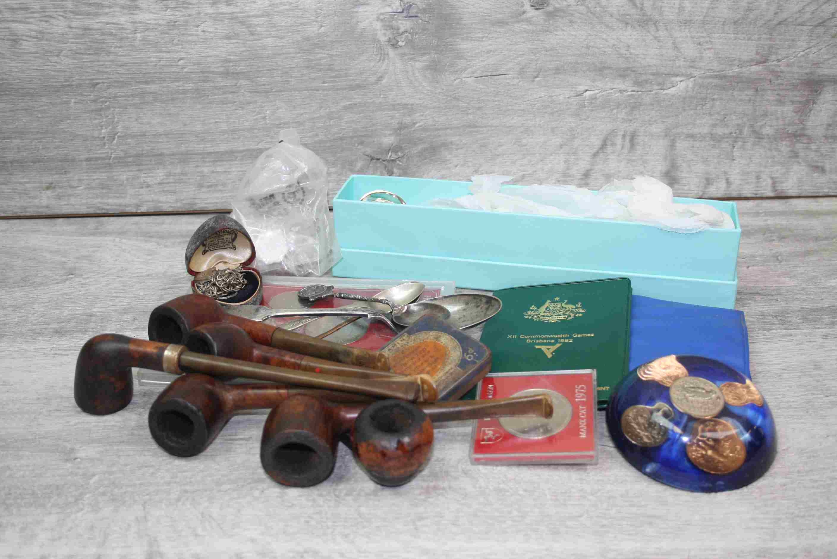 Silver plated candle snuffer, collection of tobacco pipes, small quantity of coins etc