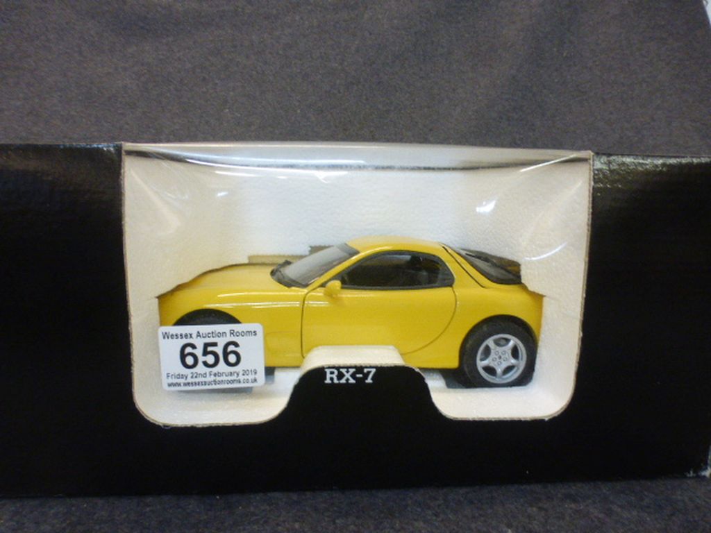 One boxed 1:18 Kyosho diecast model RX-7 L-Handle (Yellow 7010Y 12000)