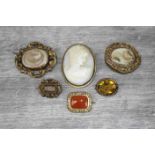 Victorian and early 20th century brooches to include carnelian gold plated lace brooch, the