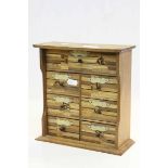 Oriental Marquetry Wooden Collector's Cabinet with seven drawers, having a Geometric design in mixed