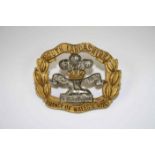 A South Lancashire Regiment Prince Of Wales Volunteers Cap Badge In Gilt Bi-Metal.