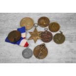 Collection of medallions and medals to include WWII Africa Star, Commemorative 1833-1933 Research