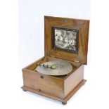 An 11" dual comb sublime harmony Polyphon disc musical box. C.1895. in good working order and with a