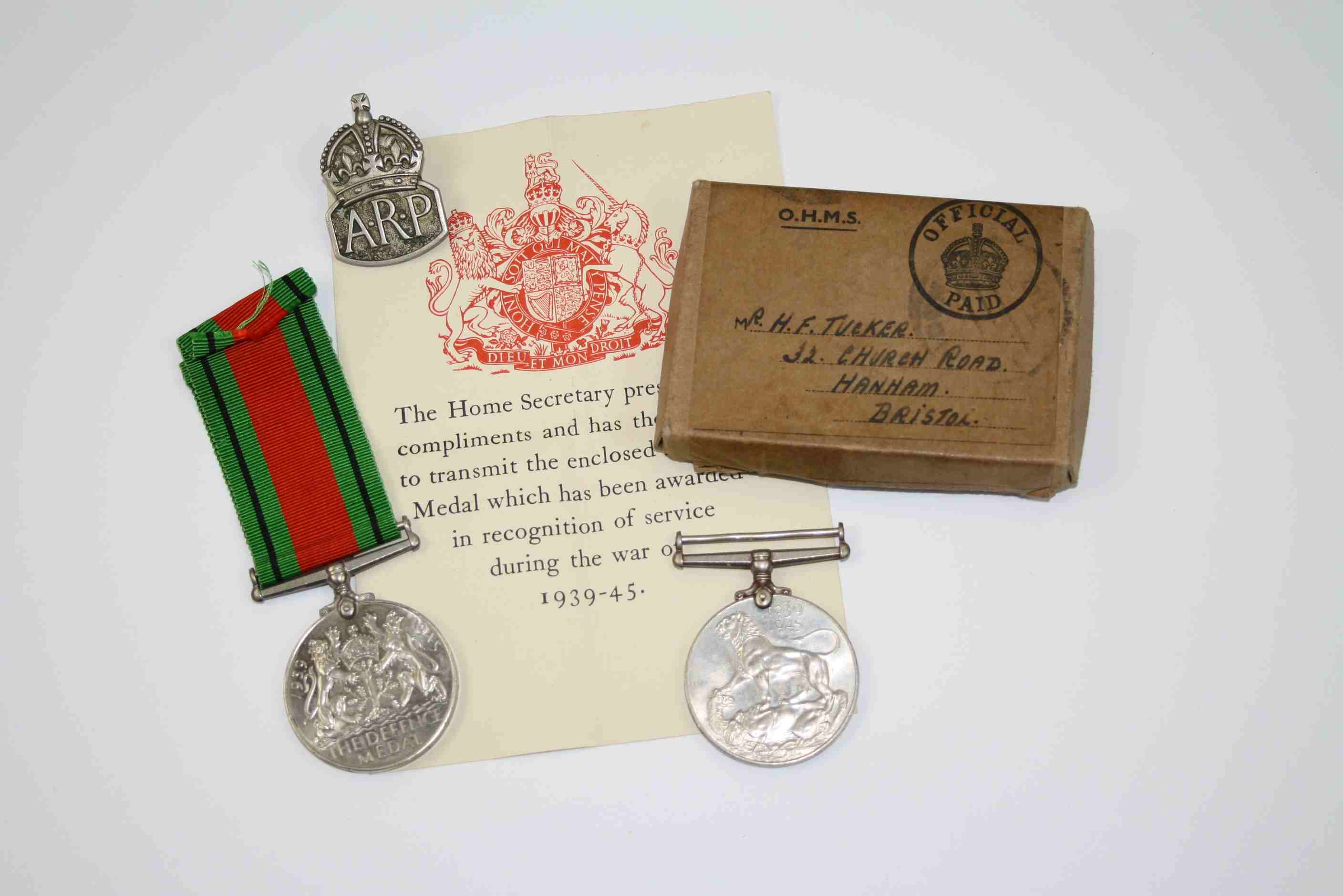 A Pair Of Full Size World War Two Medals To Include The 1939-45 British War Medal And The Defence