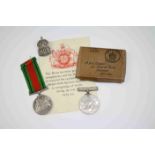 A Pair Of Full Size World War Two Medals To Include The 1939-45 British War Medal And The Defence