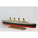 Hand made scale model of the Titanic with painted finish and on a wooden stand, approximately 14