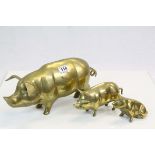 Large Brass Pig Moneybank together with Two Brass Models of Pigs