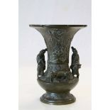 Vintage Chinese Bronze vase with flared rim, Floral decoration and mounted with two figures and a