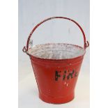 Galvanized metal Fire Bucket with red and black painted finish and swing handle, stands