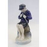 Royal Copenhagen porcelain figurine of a Young Boy cutting a Stick and marked to base DB 905
