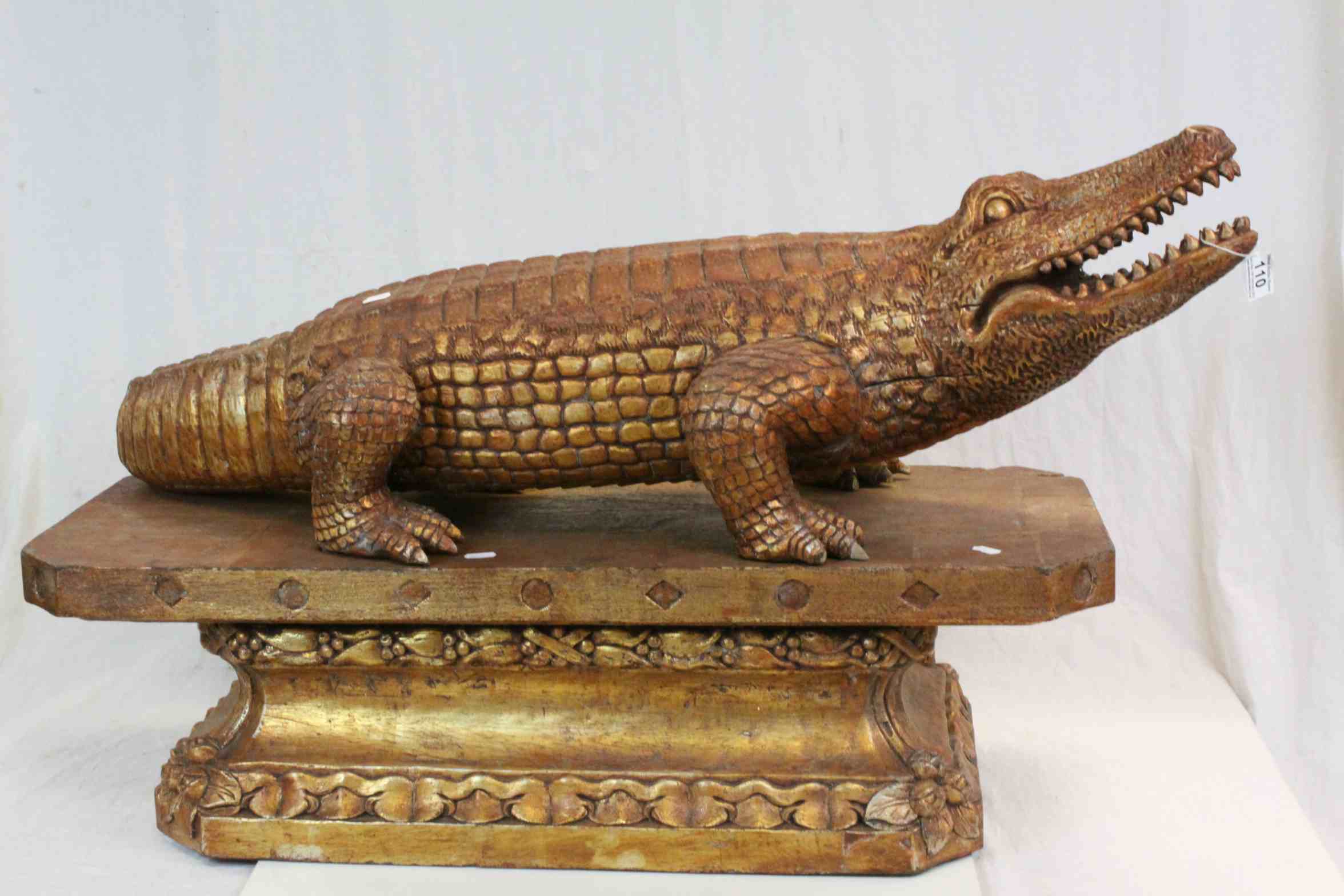 Large Asian carved Wooden model of a Crocodile with matching Hardwood plinth type stand with slots