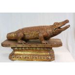 Large Asian carved Wooden model of a Crocodile with matching Hardwood plinth type stand with slots