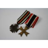 A Pair Of German Military Medals To Include A World War Two 1939 War Merit Cross With Original