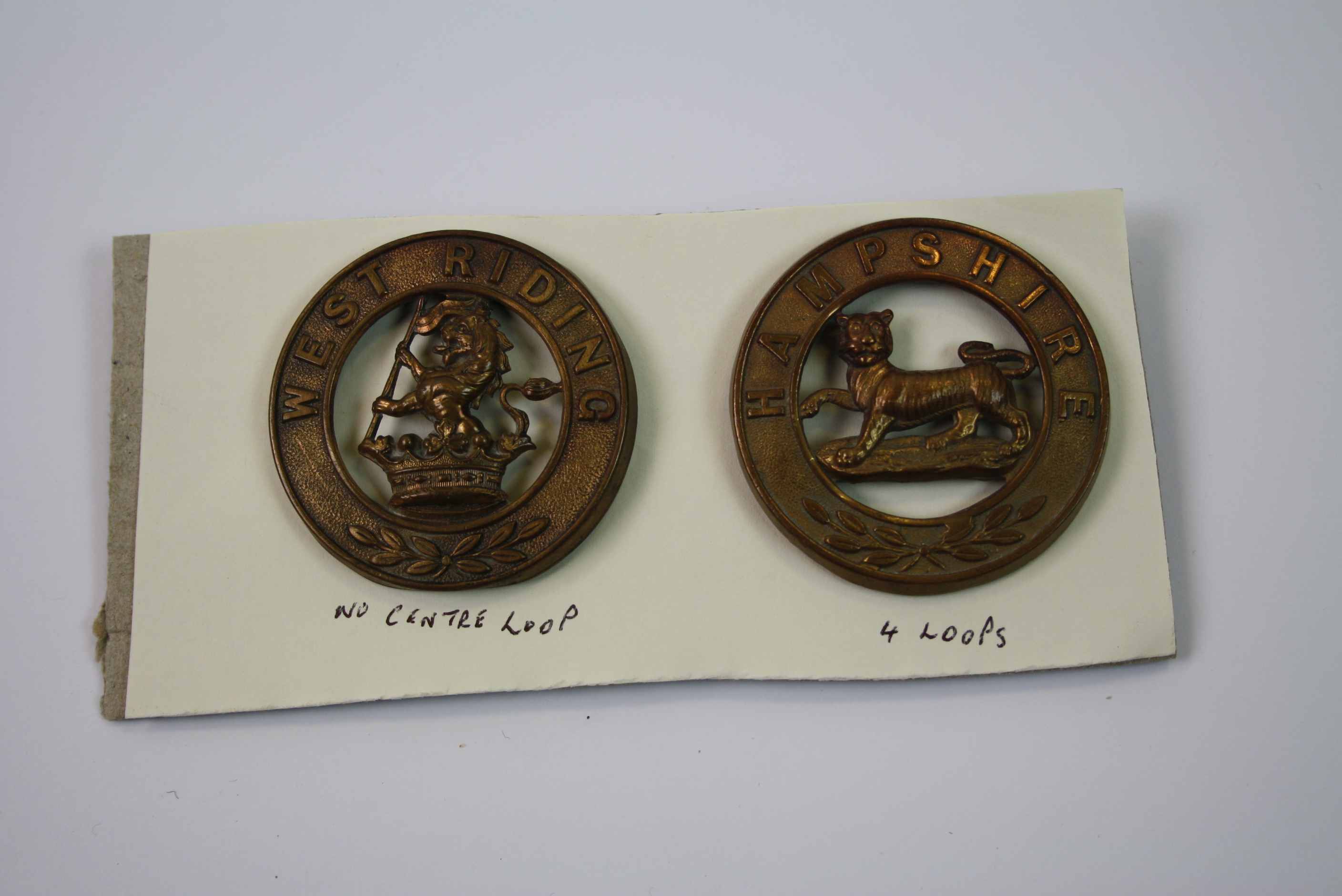 Two Brass Helmet Plate Badges For The West Riding And The Hampshire Regiment. - Image 2 of 4