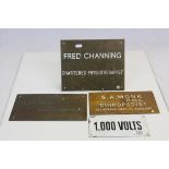 Three Bronze Business Name Plaques and an Enamel ' 1.000 Volts ' Sign