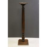 19th century Mahogany Torchere, the circular top above a partially fluted turned column support