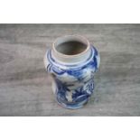 Early Delft blue and white tobacco jar, missing lid, depicting a traditional boy with bird, height