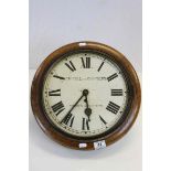 Oak framed key wind School type Wall Clock, the painted metal dial marked "Ashwell and Chambers