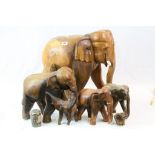 Five Hardwood Carved Elephants, the largest 53cms high plus an Elephant decorated Tin